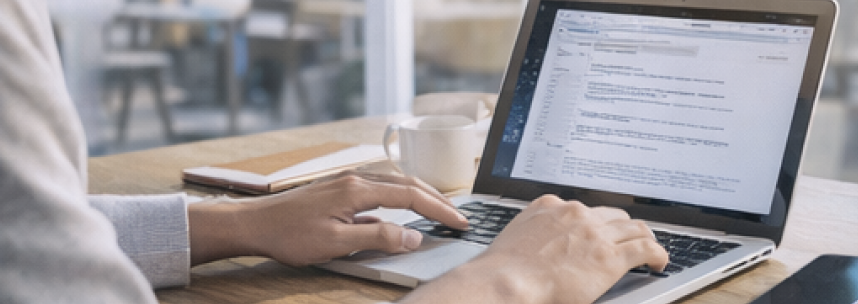 Person typing on a laptop
