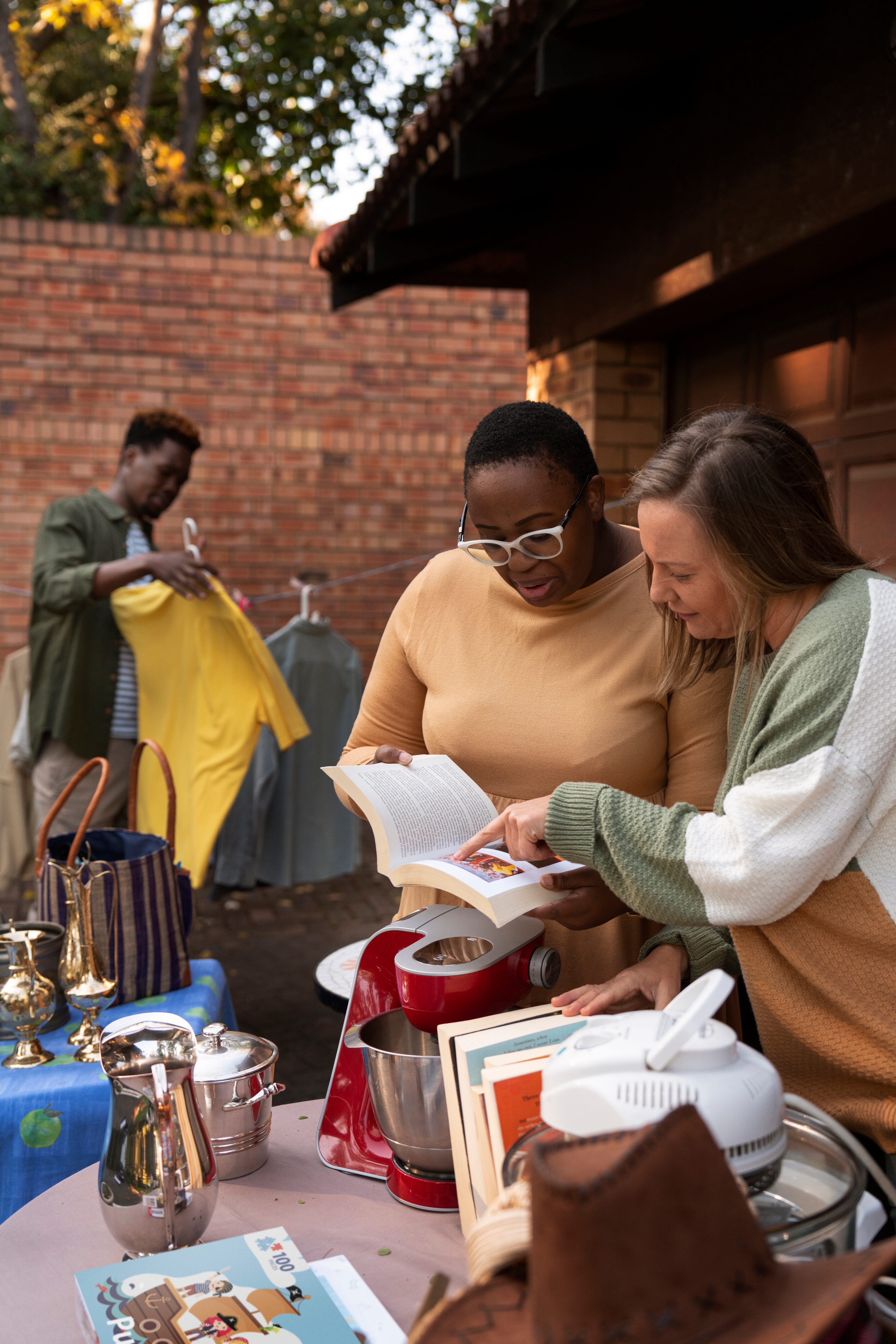 Person reading a book in a community learning setting